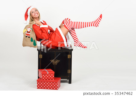 Funny blonde woman in Santa Claus clothes on white background 35347462