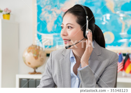 friendly female travel agent company operator 35348123