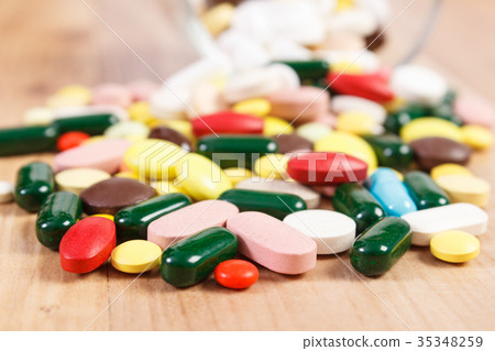 Heap of colorful medical pills and capsules 35348259