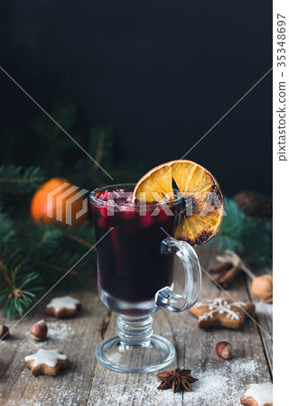Mulled wine with cranberries and cinnamon in glass 35348697