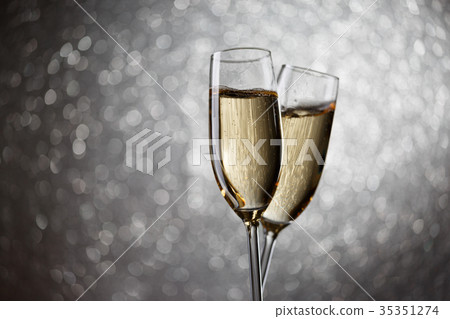 Festive image of two wine glasses with sparkling Festive image of two wine glasses with sparkling 35351274