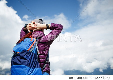 Female tourist with hands behind head Female tourist with hands behind head 35351278