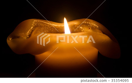 Large candle burning Large candle burning 35354095