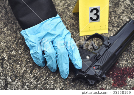 Crime scene investigation, Pistol with blood stain 35358199