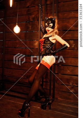 Alluring model in leather costume 35363184