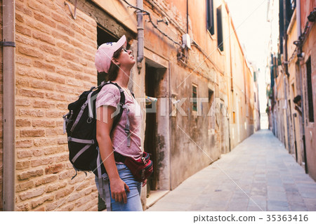 the tourist girl stands on street in venice  35363416