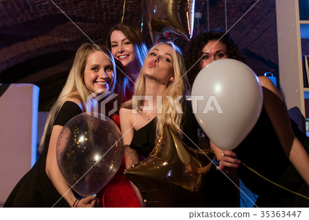 Four beautiful young Caucasian women holding Four beautiful young Caucasian women holding 35363447