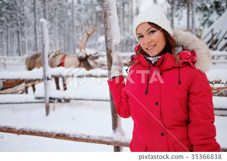 Happy woman in a snow landscape Happy woman in a snow landscape 35366838