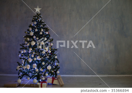 Christmas tree with garlands of lights at home for 35366894