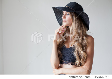 fashionable girl blonde with blue eyes in a hat 35366948