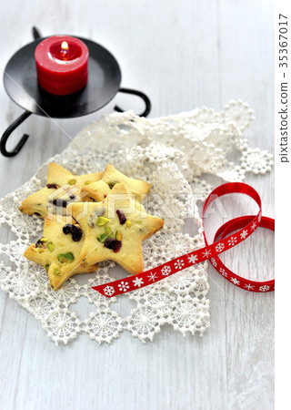 Christmas cookies (cranberry and vista thio cookies) and red ribbon 35367017