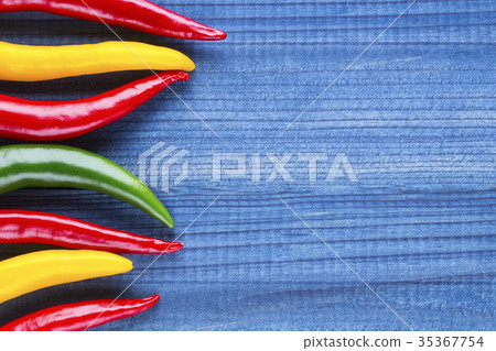 cayenne chilli peppers on wooden background cayenne chilli peppers on wooden background 35367754