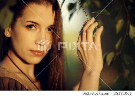 Brunette with long strong beautiful hair summer photo Brunette with long strong beautiful hair summer photo 35371001