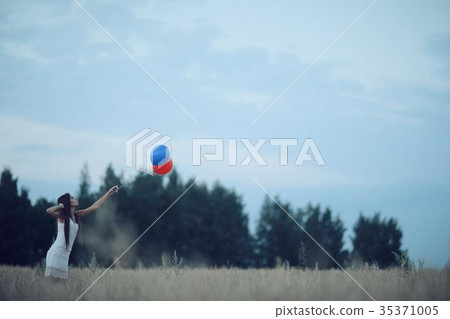 Sad lonely young girl in a field bored with depression 35371005