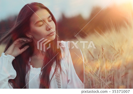Summer portrait of a young adult beautiful girl Summer portrait of a young adult beautiful girl 35371007