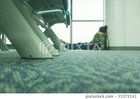 Young asian women waitting to flight by airplane 35373141