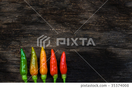 colorful of chilli on dark wood colorful of chilli on dark wood 35374008
