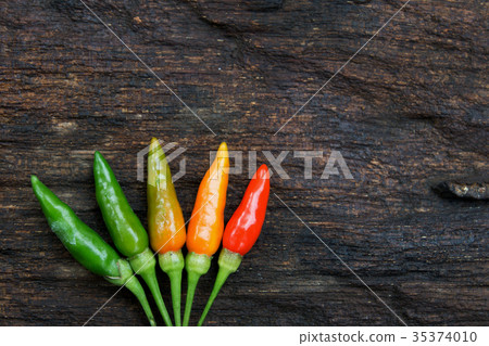 colorful of chilli on dark wood colorful of chilli on dark wood 35374010