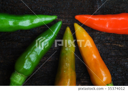 colorful of chilli on dark wood colorful of chilli on dark wood 35374012