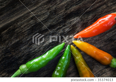 colorful of chilli on dark wood colorful of chilli on dark wood 35374013