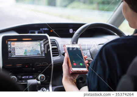 Smartphone woman while driving 35374264