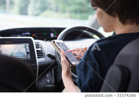 While driving while smartphone female driver While driving while smartphone female driver 35374266
