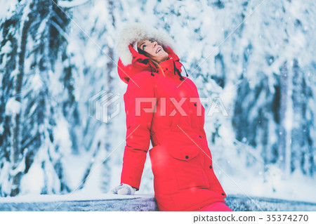 Happy woman in a snow landscape 35374270