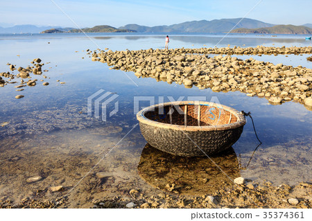 Basket boats at a lagoon on sunset in Phuoc Dong 35374361
