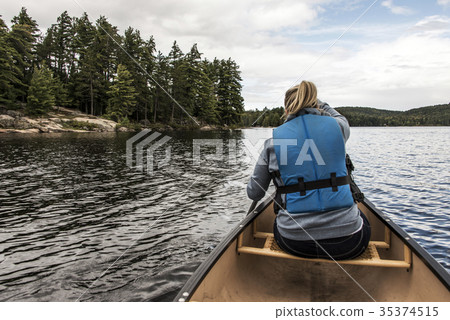 Girl canoeing with Canoe on the lake of two rivers 35374515