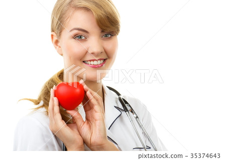 Woman doctor with stethoscope holding red heart Woman doctor with stethoscope holding red heart 35374643