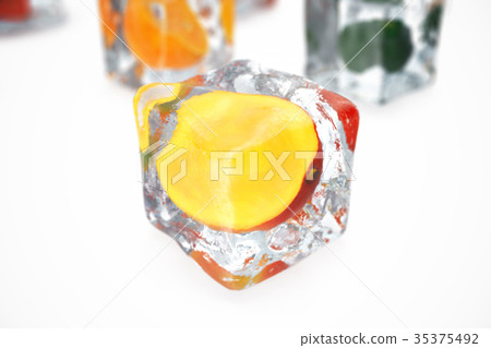 Mango in ice cube isolated on white with depth of Mango in ice cube isolated on white with depth of 35375492