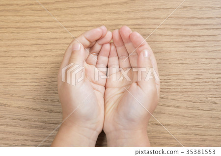 Children putting out both hands Children putting out both hands 35381553