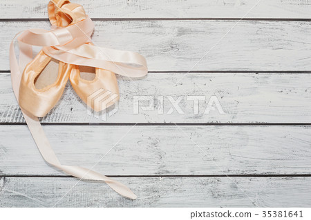 Ballet shoes on wooden floor 35381641