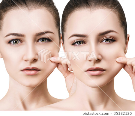 Young woman pulling her elasticity skin Young woman pulling her elasticity skin 35382120