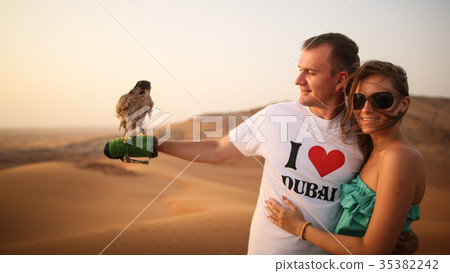 Girl and the guy keep on hand eagle. Desert in Abu 35382242