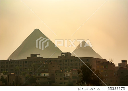 The Great Pyramids towering beyond Giza city 35382375