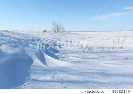 Snow island on the river in winter Snow island on the river in winter 35382399