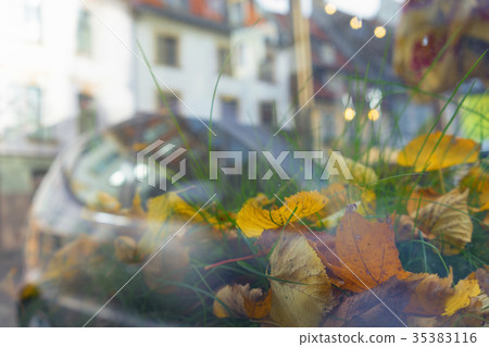 Reflection of the city in the glass in the fall 35383116