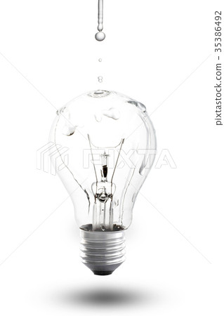 water drops on light bulb isolated background. water drops on light bulb isolated background. 35386492
