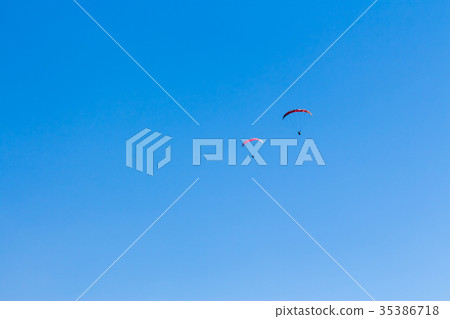 Sky Diving with space in solid blue sky Sky Diving with space in solid blue sky 35386718