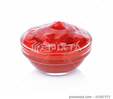 Tasty ketchup in bowl isolated on white Tasty ketchup in bowl isolated on white 35387372