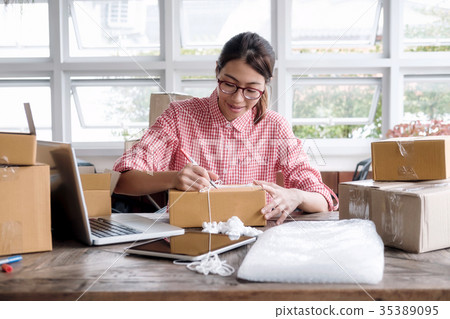 Business owner working at home, 35389095