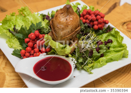 quail roasted with sweet and sour cranberry sauce quail roasted with sweet and sour cranberry sauce 35390394
