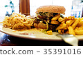 Unhealthy meal with mexican nacho chips, beef 35391016