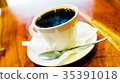 Black coffee in white cup on the brown wooden 35391018
