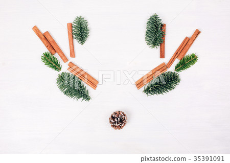 Deer face made of fir branches. 35391091