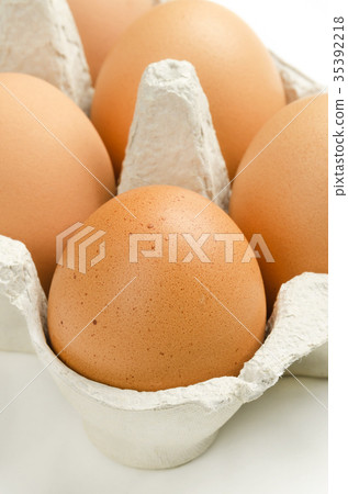 Brown chicken eggs in gray egg carton 35392218