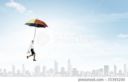 Woman fly on umbrella 35393200