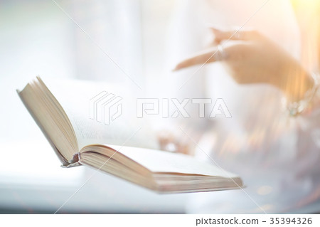 Young adult girl with book learning, reading, business 35394326