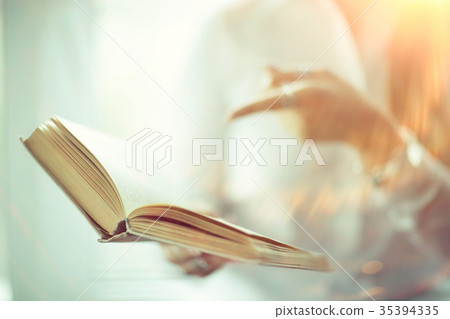 Young adult girl with book learning, reading, business Young adult girl with book learning, reading, business 35394335